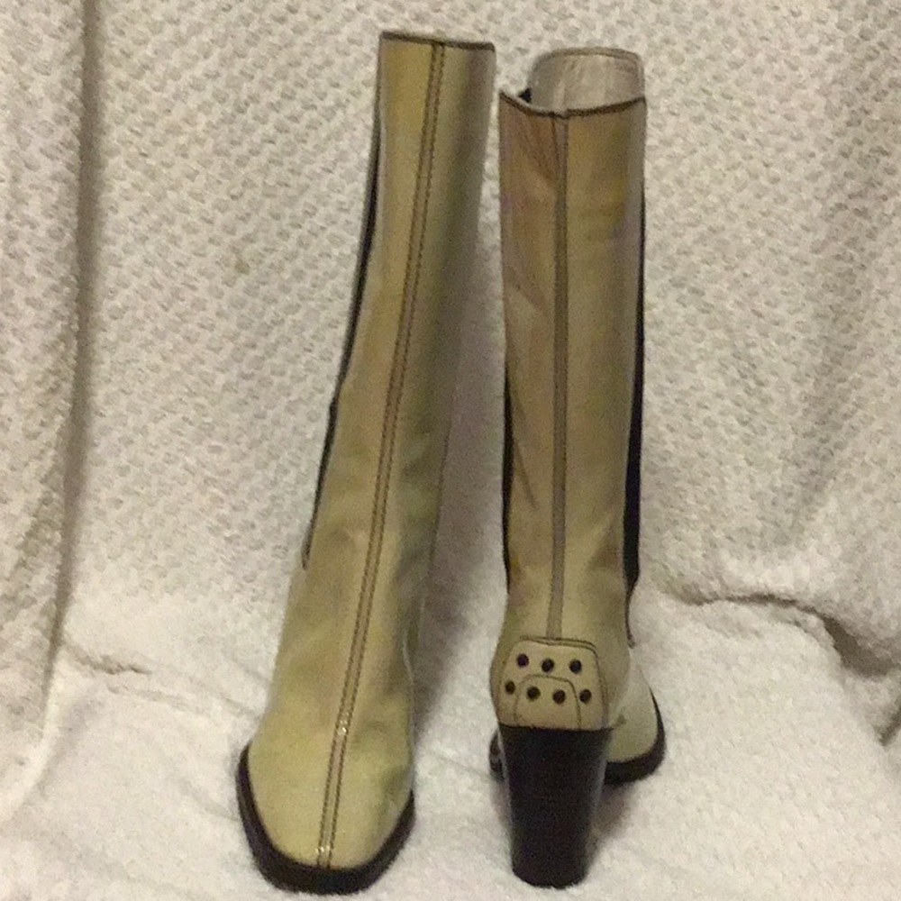 TOD’s cream colored patent leather knee boots.
